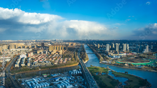Aerial view of Tonghui River and Beijing city skyline, China
