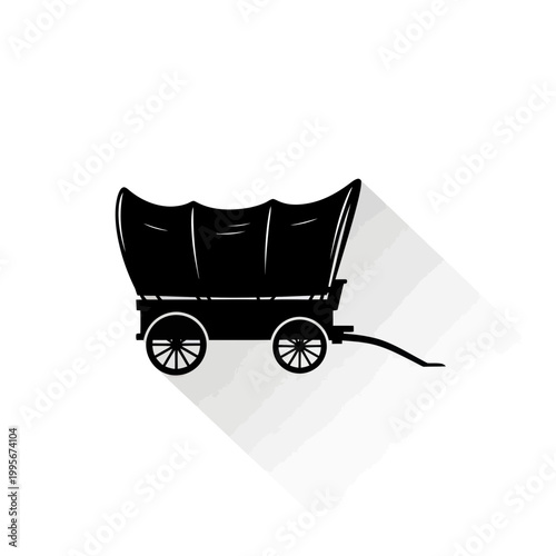 Silhouette of a vintage covered wagon with long shadow