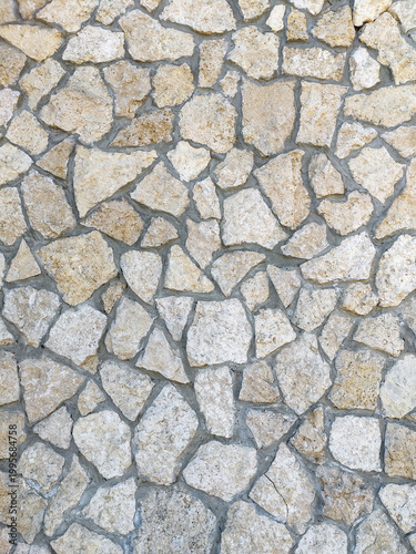 Masonry made of natural limestone or sandstone stone. Decorative wall cladding, paving. Full frame