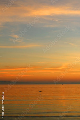 Colorful sunset or sunrise sky over the sea.