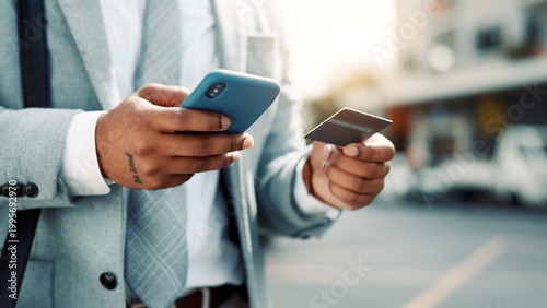 Fotografie Businessman, hands and credit card with phone in city for online shopping or mobile banking app