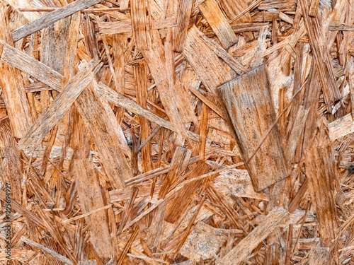 Photos Pressed wood chip panel surface with brown strand texture for construction mater