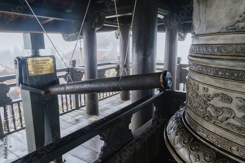 Photos Close-up of a large bell and striker at a pagoda in Ba Na Hills, Da Nang, Vietnam