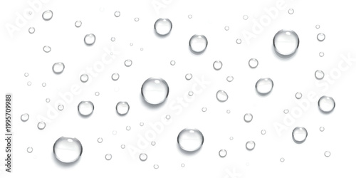 Clear water drops and rain bubbles spread on a surface
