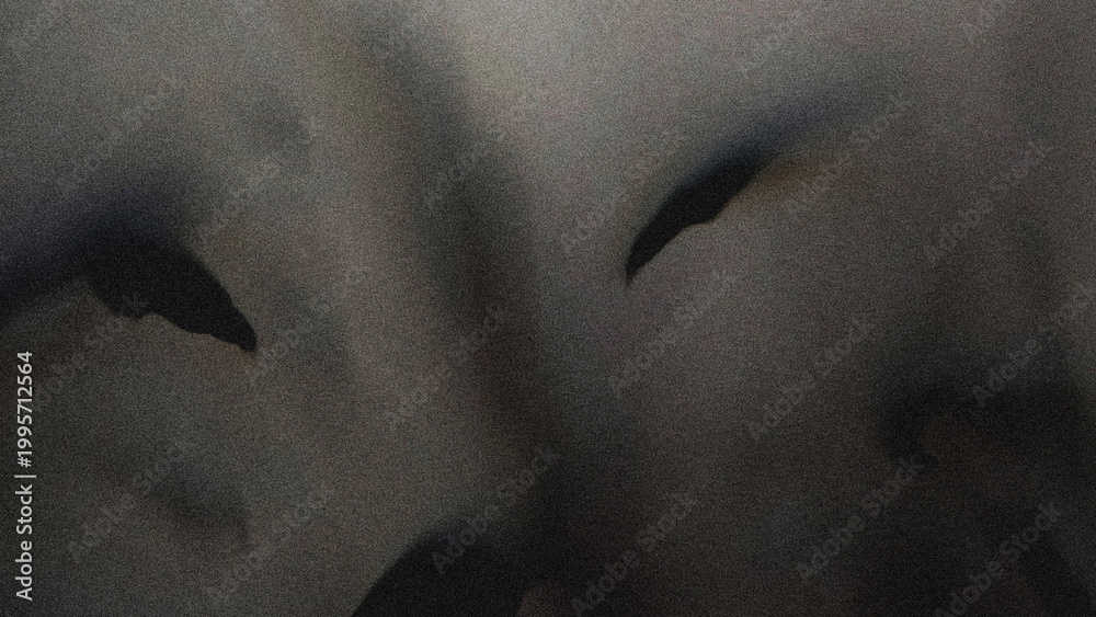Obraz premium Abstract dark frosted glass background with grainy noise and blurry tropical leaf silhouettes. Moody botanical texture with soft glow and elegant matte finish perfect for luxury designs