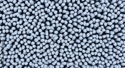 Close up of small spherical plastic pellets a textured background of polyethylene beads for industrial applications