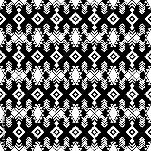 Seamless geometric pattern with black and white ethnic tribal motifs. Abstract vector background featuring repetitive diamond shapes, triangles, and square elements. Ideal for fabric print, wallpaper,