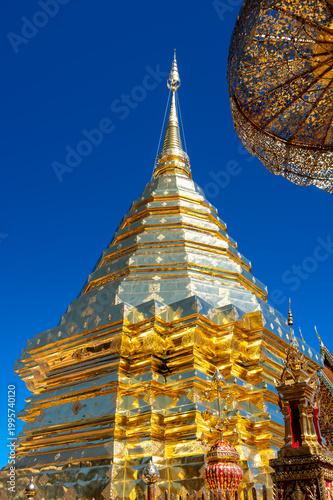 Golden stupa of Wat Phra That Doi Suthep temple in Thailand, richly decorated Buddhist structure with statues and ornate details, spiritual landmark in Chiang Mai