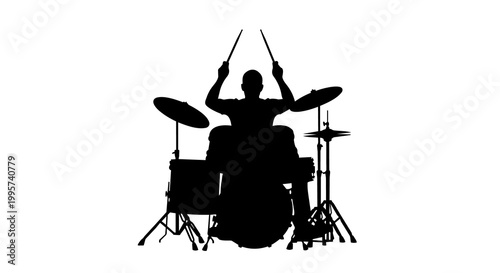 Fotografija Silhouette of a drummer playing a drum kit with sticks, isolated on transparent