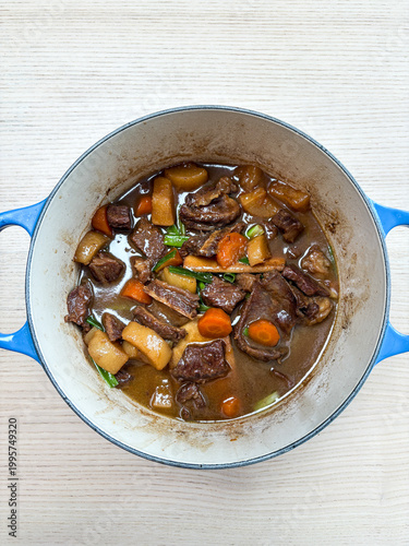 A pot of beef and vegetable stew.