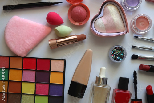 Various colorful cosmetic products on white background. Flat lay.