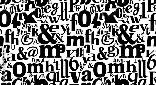Black letters fill the frame with a dense arrangement of typographic characters.