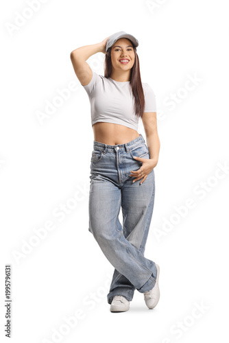 Young woman in casual streetwear, crop top and jeans
