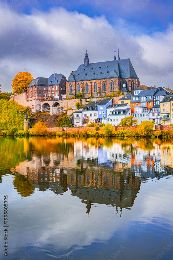 Fototapeta premium Saarburg, Germany. Water reflection landscape with charming old town on Saar River.