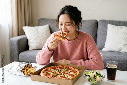 Young Woman Enjoying Pizza and Fries at Home