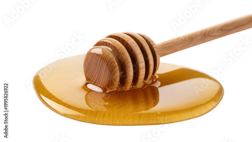 Konstfotografi Wooden honey dipper dripping golden honey into shallow round dish