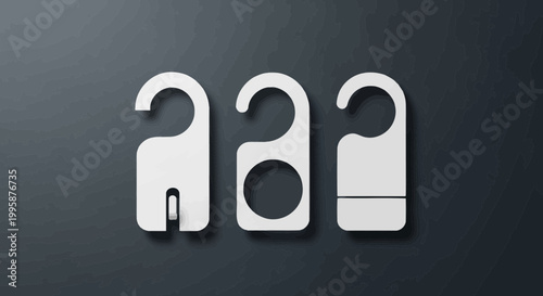 Three white door hangers with different designs on a dark textured background