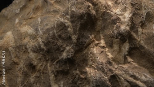 Close-up rugged rock formation with mixed mineral layers and texture