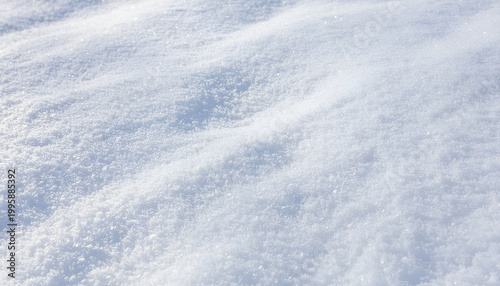 Windswept fresh snow surface with glittering ice crystals texture.