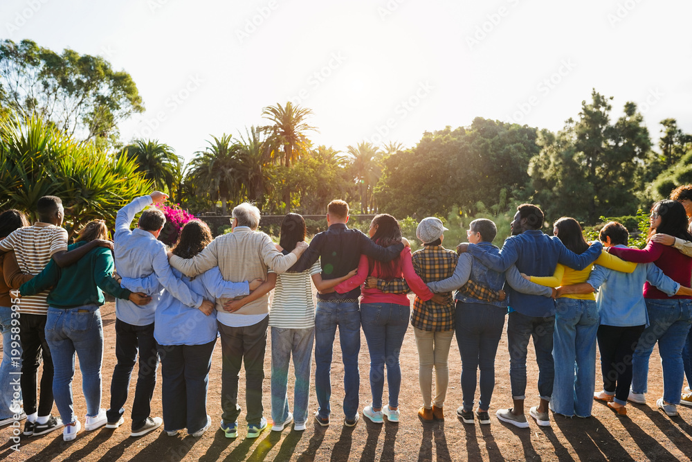 Obraz premium Group of multigenerational people hugging each others - Support, multiracial and diversity concept - Main focus on senior man with white hairs