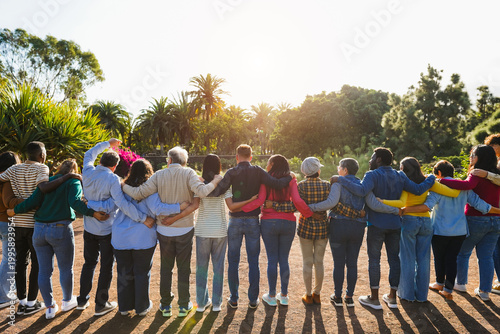 Fotografia Group of multigenerational people hugging each others - Support, multiracial and