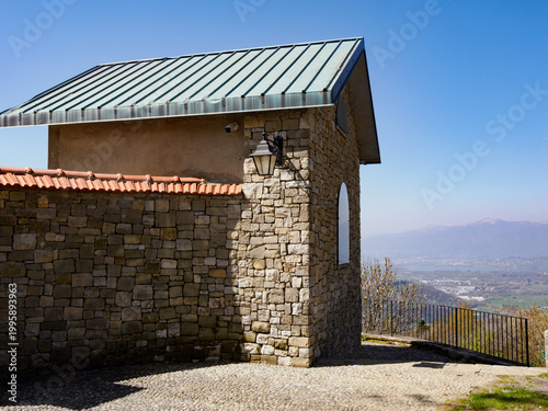 Springtime landscape along the road to Colle Brianza at Ravellino, Lecco province, Italy: church and cemetery
