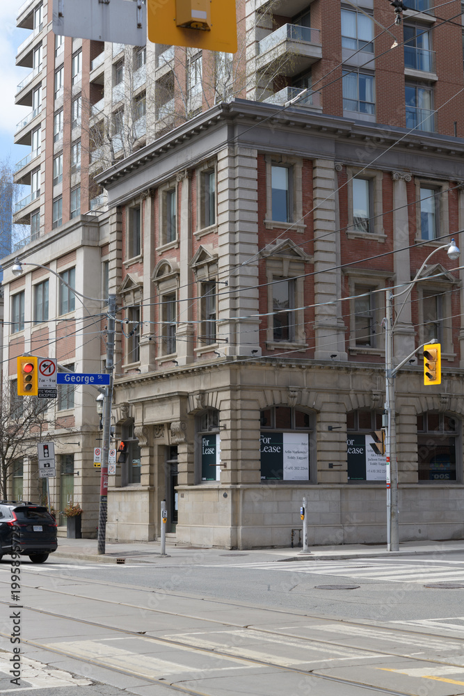 Fototapeta premium wide view of historic property at 172 King St E (northwest corner at George St) located at Sovereign Bank, designed by George W. Gouinlock, 1907, Toronto
