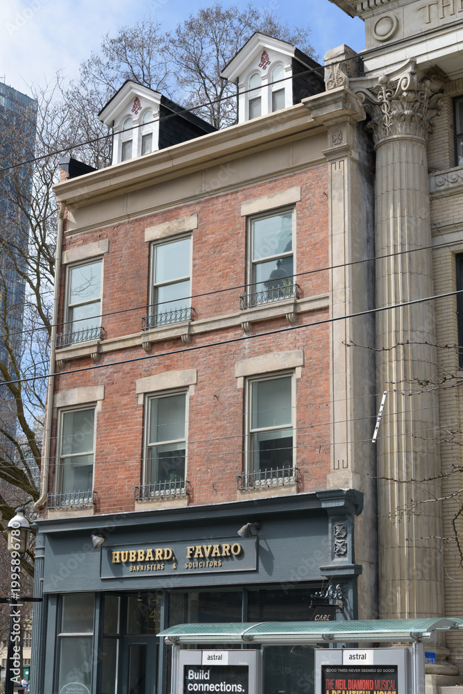 Fototapeta premium exterior building facade and sign of Hubbard Favaro, an attorney office, located at 142 King St E (historic building known as St Lawrence Galleries), Toronto