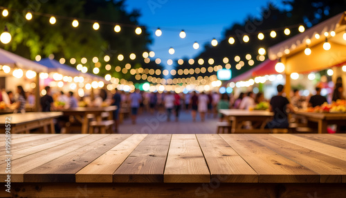 Wooden table with bokeh lights at outdoor night food market.