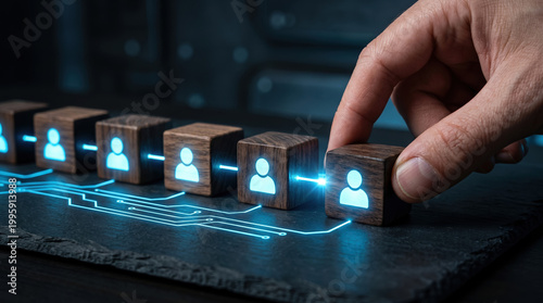 Concept of human resources management and team building with wooden cubes and digital connection