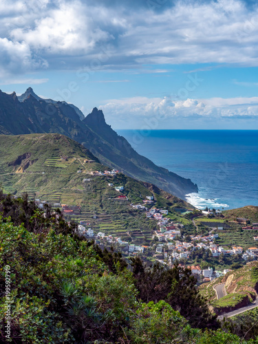 A view of Taganana and the coastline beyond, with the sea in the background, from a hill overlooking Taganana