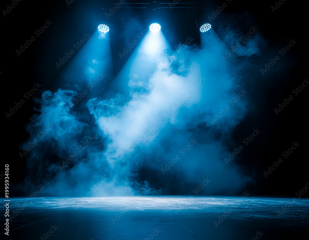 Obraz premium Blue stage spotlights with dramatic fog and empty floor.