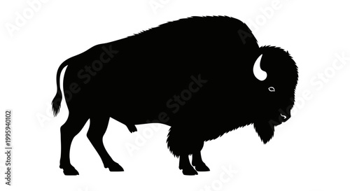 Black silhouette of a bison standing.