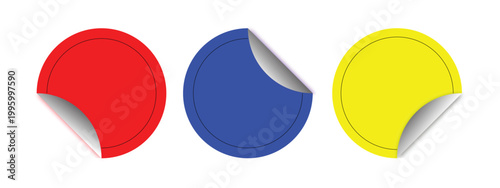 Three colorful circular stickers with peeling corners isolated on a white background providing copy space