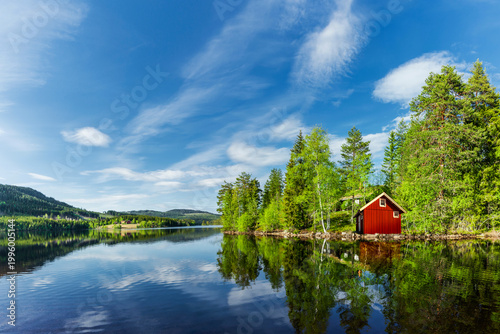 Red house on a lake in Scandinavia