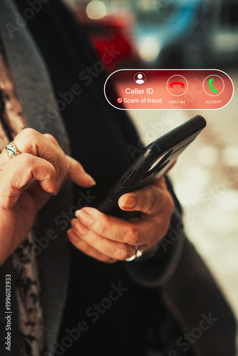 Scam Phone Call Alert on Smartphone Held by Senior Woman Warning of Fraud. Cybersecurity awareness, consumer protection, telecom, and online fraud prevention.