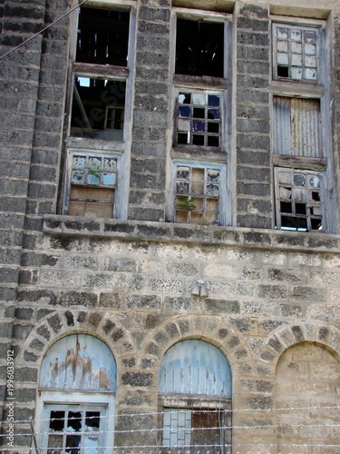 Vászonkép old building facade with broken windows