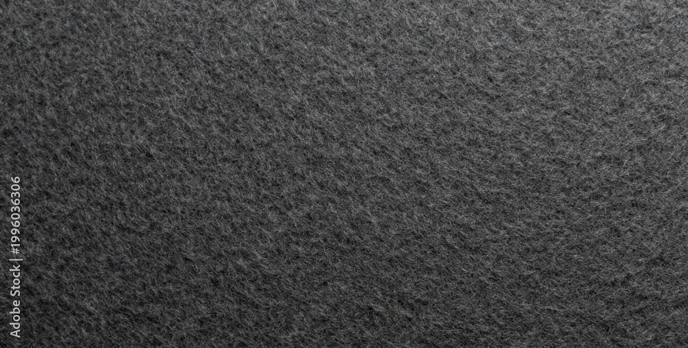 Fototapeta premium Industrial product black fabric material background texture. Seamless gray felt cloth fibre pattern.