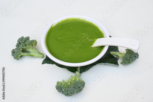 Broccoli soup on white background. It is just as nutritious as it is visually appealing. Crafted into a perfectly smooth, silky, and emerald-green puree, it delivers the fresh taste of green vegetable