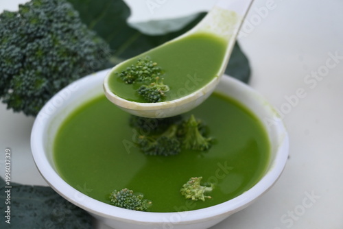 Broccoli soup on white background. It is just as nutritious as it is visually appealing. Crafted into a perfectly smooth, silky, and emerald-green puree, it delivers the fresh taste of green vegetable