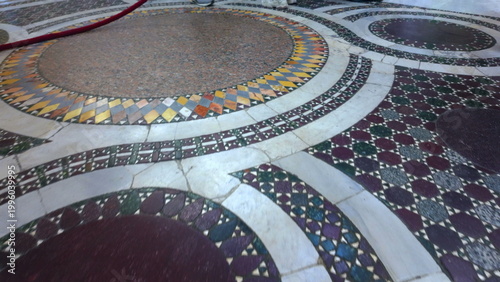 Fotografie Circular marble mosaic floor inside Basilica di Santa Prassede in Rome with geom