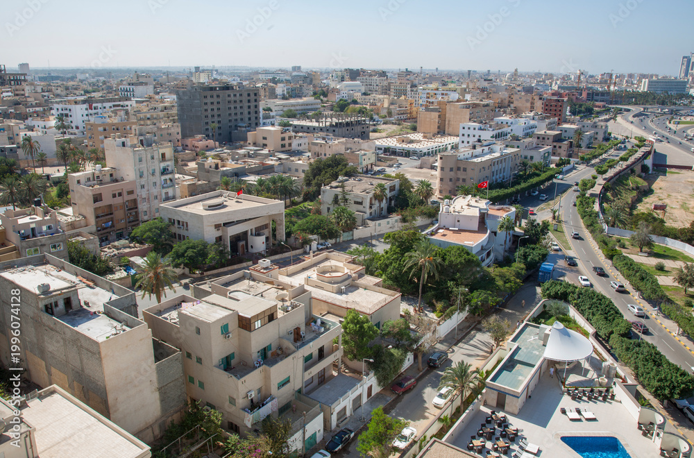 Fototapeta premium An aerial view of Tripoli, Libya, overlooking buildings and roads, looking in a westerly direction.
