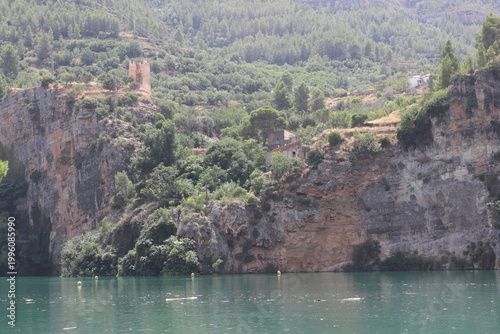 Ancient Watchtower and Rural Houses on Limestone Cliffs in Cortes de Pallas