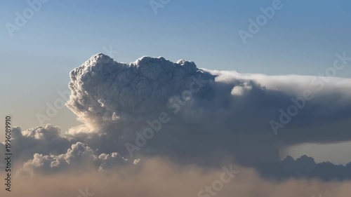 A massive nuclear explosion in a barren desert, iconic mushroom cloud rising rapidly