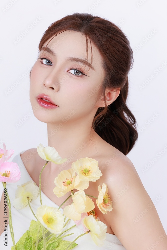 Fototapeta premium Beauty portrait of Asian woman with healthy radiant skin holding flower, aesthetic clinic and cosmetic treatment concept.