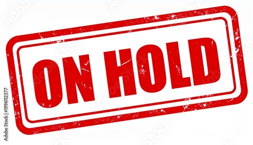 Red ON HOLD stamp impression, delay and official suspension symbol in bold distressed design