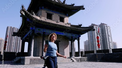 Tourist taking a selfie on the ancient city wall of Xi'an in China