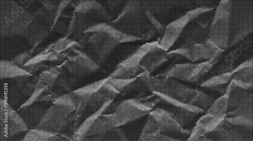 High contrast black and white halftone wave pattern for edgy graphic designs. Halftone crumpled paper texture with wite a dotted, rough, and wrinkled surface. Black creased sheet background 
