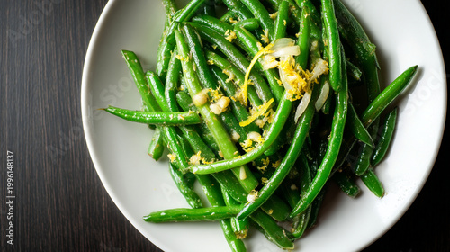Healthy green beans with garlic and lemon zest top view side dish