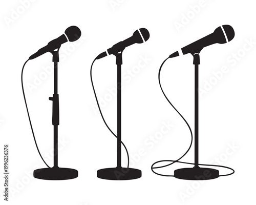 Silhouettes of microphones on adjustable floor stands with cables for stage performance and events.